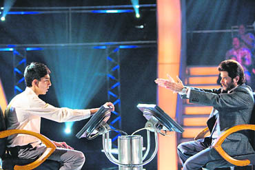 Anil Kapoor and Dev Patel in a still from Slumdog Millionaire