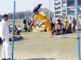 A girl participates in a long jump competition at  Tau Devi Lal Stadium in Sector-38, Gurgaon on Sunday.