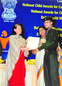 Cadet Leonard Arambam of Rashtriya Indian Military College, Dehradun, receives the National Child Award 2008 from UPA chairperson Sonia Gandhi in New Delhi.
