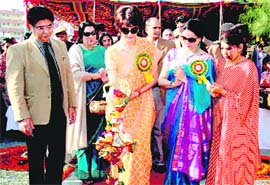 Payal Abdullah, wife of Chief Minister Omar Abdullah, lights the lamp to declare a police mela open in Jammu on Sunday. 