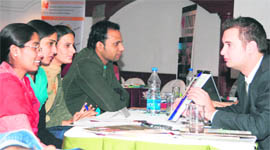 Students interact with the representatives of Australian colleges during an education fair organised by Kangaroo Studies in Ludhiana.