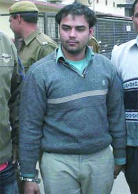 Qasim of the Naeem Sabir gang is produced at Tis Hazari Court by Delhi police special cell team after being arrested from Munabao Railway Station, Badmer, Rajasthan