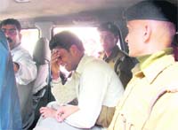 The accused being escorted to the police station in Haridwar on Monday.
