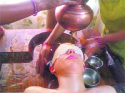 A patient undergoes Sirodhara treatment at Shri Ayush Ayurvedic treatment centre in Dehradun.