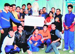 The Udham Singh Nagar Police team with the winners trophy in Roorkee.