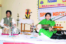 Sarod player Danish Aslam Khan and tabla player D Bhowmik give a performance at Fatehabads Manohar Memorial Postgraduate College.