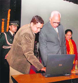 Governor NN Vohra launches the website of the Association for Social Health in India (J&K chapter) in Jammu on Monday.