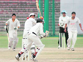 Sachin Sohal, who played sensible knock of 21 runs for GMSSS-35, misses a ball during their semifinal against DAV-8 at the Sector 16 Cricket Stadium.