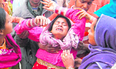 Sister of Sachin, who was allegedly murdered, in an inconsolable state at the Doon Hospital in Dehradun on Tuesday.