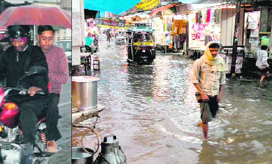 A motorcycle pillion-rider with an umbrella as the first winter rain lashed Dehradun on Tuesday evening (left). Sudden rain that lashed Haridwar on Tuesday resulted in flooded roads.