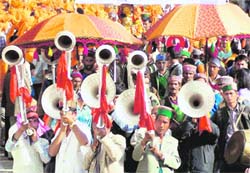 Bajantris give a performance at the Shivratri fair in Mandi.