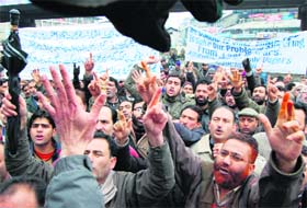 Government employees hold a protest in Srinagar