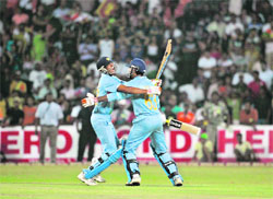 Yusuf Pathan (left) and Irfan Pathan celebrate victory over Sri Lanka during the Twenty20 cricket match in Colombo
