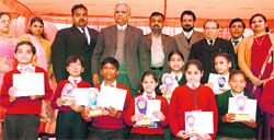 Students of N.M. Jain Model Senior Secondary School with their awards during the annual prize distribution function in Ludhiana