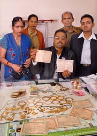 M.K. Panwar, post commander, RPF, shows the valuables found in possession of a mentally depressed woman in Bathinda