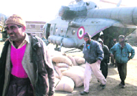 An IAF chopper unloads flour at Bhaderwah.