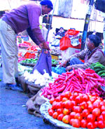 Vegetable vendors at the Sabzi Mandi in Maqsudan