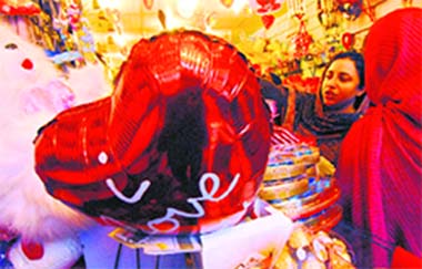 Pakistan women shop for Valentines Day gifts in Peshawar on Thursday.