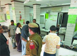The police carries out investigation at the Minto Road branch of Oriental Bank of Commerce in New Delhi on Friday.