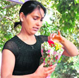 A girl buys roses on Valentines Day in Sector 14, Gurgaon,