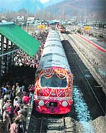 The first train connecting Baramulla with Mazhom in central Kashmir arrives at Baramulla railway station on Saturday. The train was flagged off by UPA chairperson Sonia Gandhi.