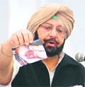Capt Amarinder Singh at a press conference in Chandigarh on Saturday.