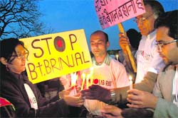 Activists of the Kheti Virasat Mission hold a candlelight protest against genetically modified brinjal at Sukhna Lake in Chandigarh on Sunday.
