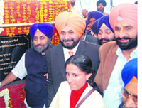 Deputy Chief Minister Sukhbir Singh Badal (first from left) lays the foundation stone of business district centre, in Amritsar on Sunday.