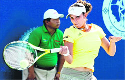 Sania Mirza returns a shot to Vera Zvonareva of Russia during their final match of the Pattaya Open tennis tournament in Pattaya, southeast of Bangkok, Thailand