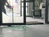 Broken window panes of the Dehradun passport office.
