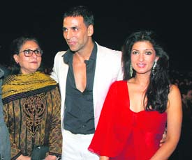 Actors Jaya Bhaduri Bachchan, Akshay Kumar and his wife Twinkle Khanna (L-R) pose on the red carpet. 