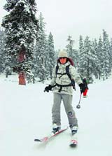 A foreign tourist goes skiing in Gulmarg.