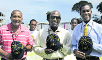 West Indies' cricket legends (from left) Andy Roberts, Sir Vivian Richards and Michael Holding pose for a picture after they were presented with their ICCs Hall of Fame caps