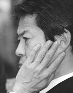 Japanese Finance Minister Shoichi Nakagawa waits for the opening of the budget committee session at the National Diet in Tokyo