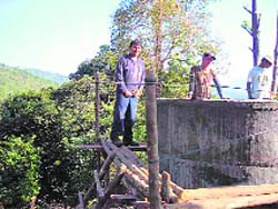Rajit Garg, builds a water tank as part of the Round Square International Service Project. 