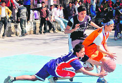 Cagers of All Star Club and DAV (PG) College vie for the ball during the final of the womens section of the 25th Prof RK Shukla Memorial Basketball Tournament in Dehradun