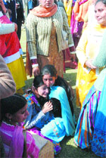 Relatives of the victims console each other.
