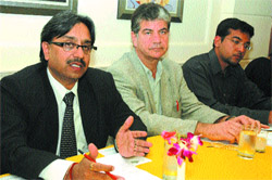 Mayor Rakesh Rathore addresses a press conference along with consultants of the World Bank in Jalandhar.