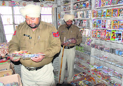 Cops checks pirated CDs at Bhadour House in Ludhiana.