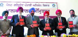 Khalsa College principal Daljit SIngh (3rd from left) releases the book of NRI Shamsher Singh Sandhu in Amritsar 