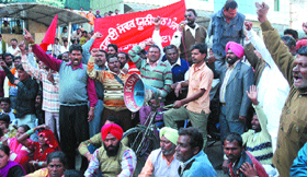 Members of the Safai Sewak Union, Punjab, during a protest rally outside local bodies minister Manroanjan Kalias residence in Jalandhar on Friday.