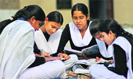 Students of Government Girls Higher Secondary School, Canal Road, Jammu, study for the board examinations.