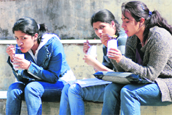 Girls enjoy food on a sunny day at Khalsa College for Women, Ludhiana