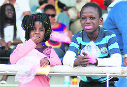 Foreign children enjoy the football match between Chirag United and JCT National Football League at Guru Nanak Stadium in Ludhiana on Saturday.