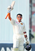 Mahela Jayawardene waves his bat after completing his century during the first day of first Test against Pakistan at National Stadium in Karachi