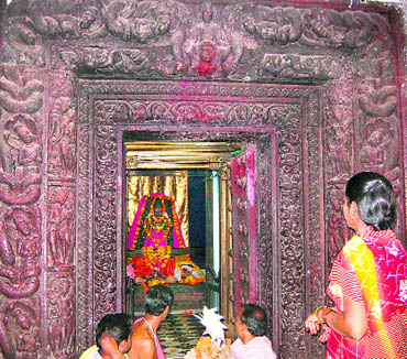 The massive doorframe of the sanctum sanctoram of Rajiv Lochan Temple has intricate carvings
