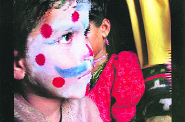 A still from King of India. Seven-year-old Raja Hindustani gets ready for a street performance  