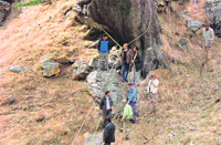 Rescue operations in progress to retrieve the bodies of tourists at the accident site at Kothi on theManali- Rohtang road