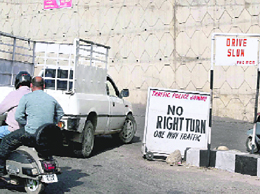 These riders seem to give a damn to the direction for No right turn near the MLAs Hostel in Jammu.