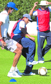 Sachin Tendulkar (C) tries out his football skills with the Indian team members during a practice session at Lincoln Oval in Christchurch on Sunday.